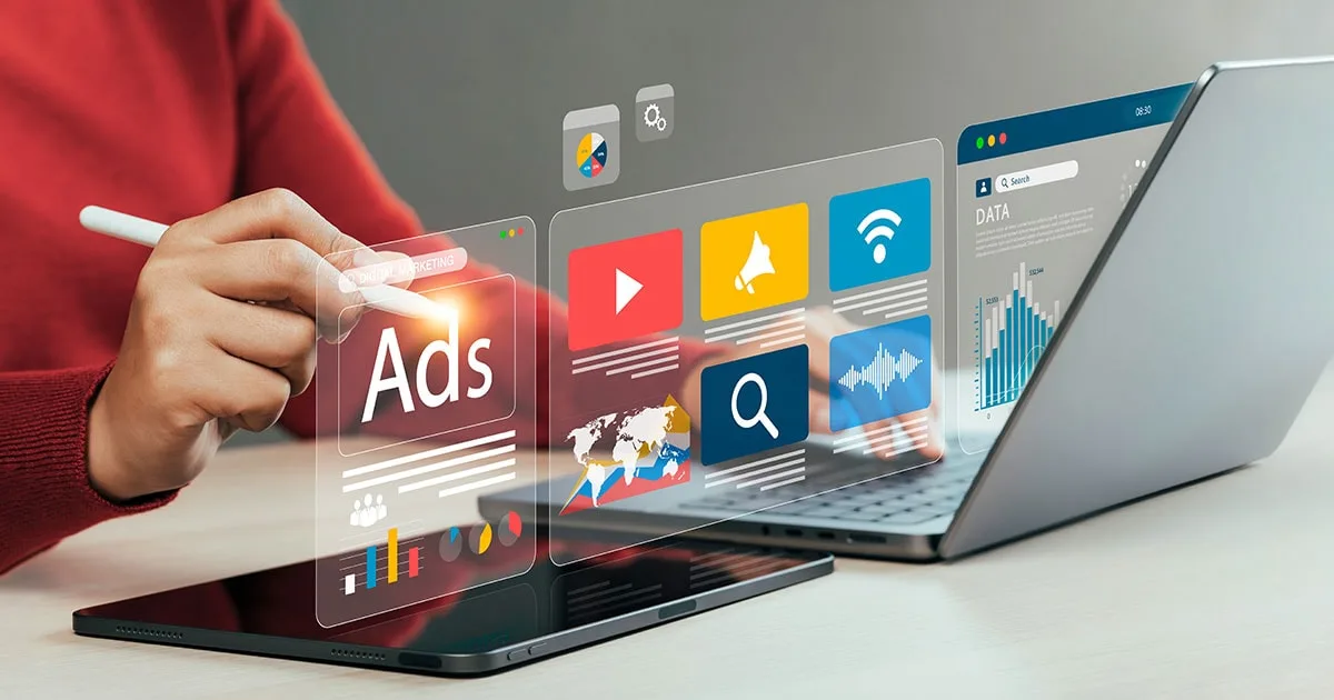 A person uses a stylus on a tablet, interacting with a holographic marketing dashboard showing ads, analytics, and data insights.