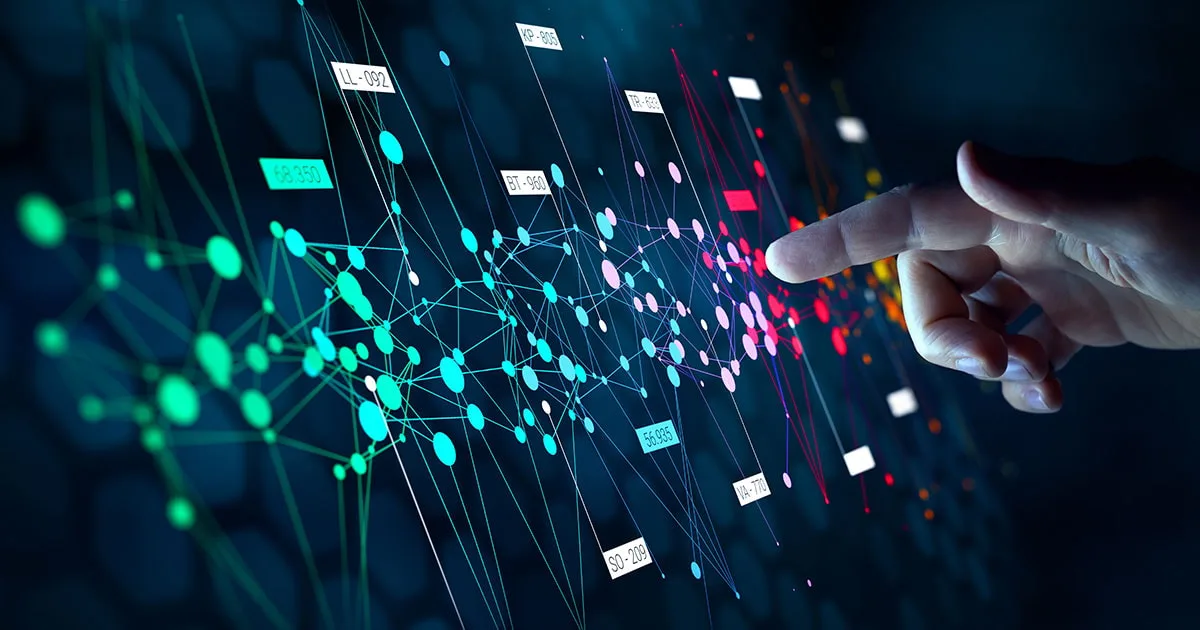A hand interacts with a digital network of interconnected data points and labels, symbolising big data analysis, AI, and machine learning.